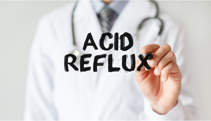 Medical professional writing "ACID REFLUX"