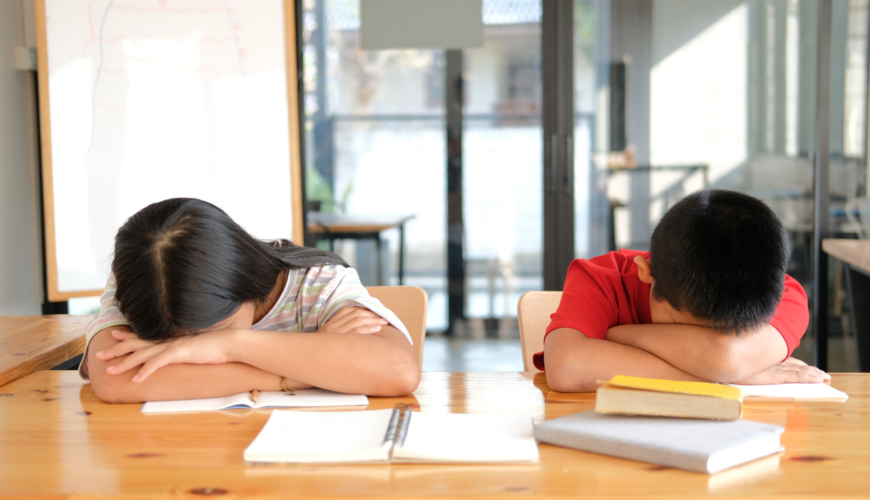 Insomnia in children, kids sleeping on desk